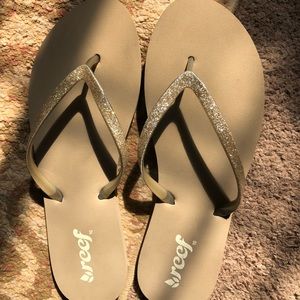 Brand new gold Reef women’s flip flops.